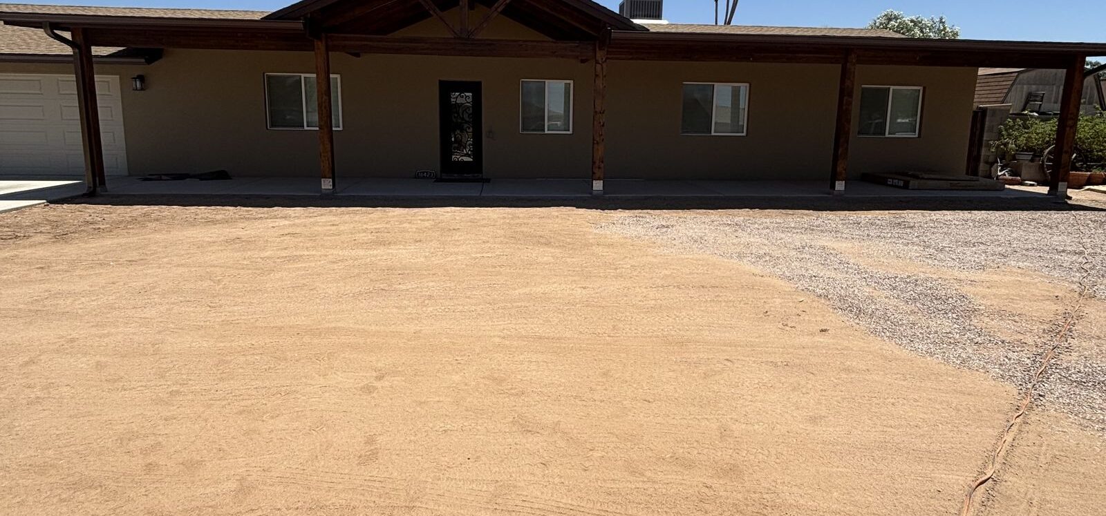 Wide view of desert home exterior — Grizzly Rain Gutters service area Phoenix AZ