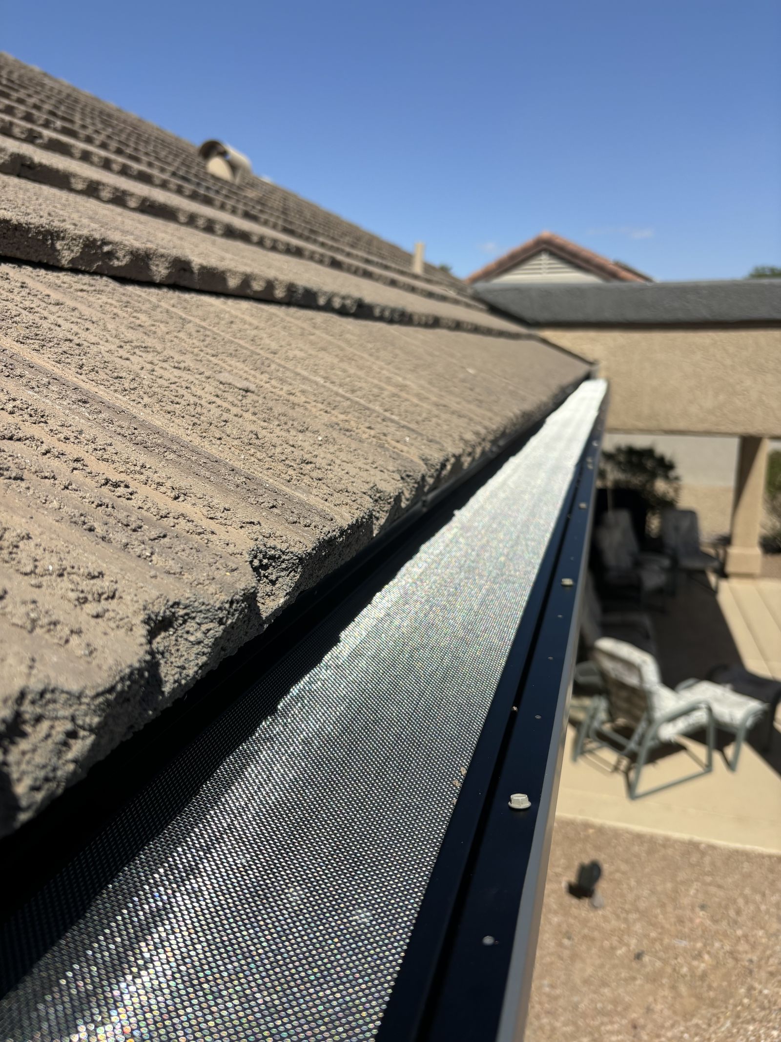 Gutter guard installed on concrete tile roof — Grizzly Rain Gutters Phoenix AZ