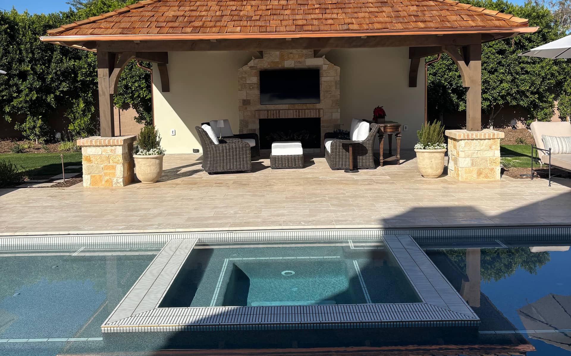 Copper gutters on a poolside cabana at a Phoenix Valley property maintained by Grizzly Rain Gutters